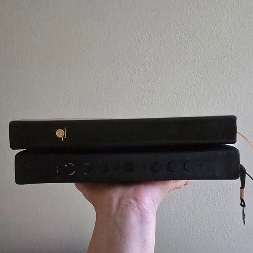 notebook therapy moonlit wish and buke notebook stacked on hand